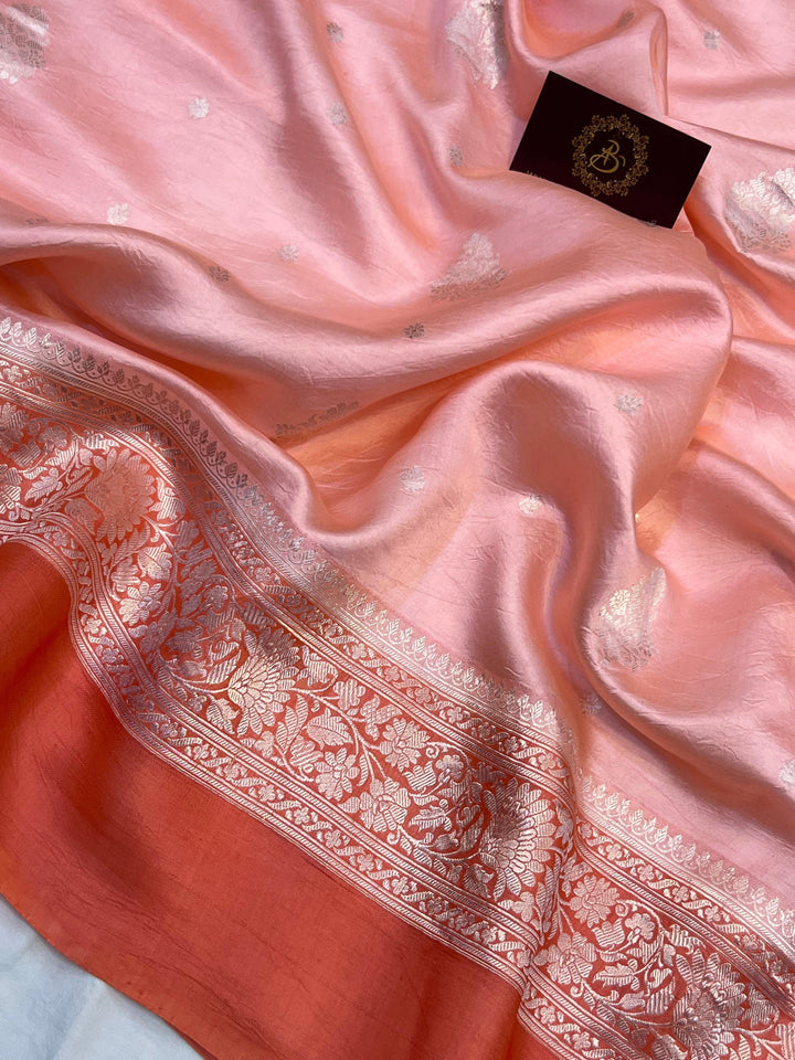 Intricate silver zari Kadhwa buta and buti on Banarasi pure silk saree