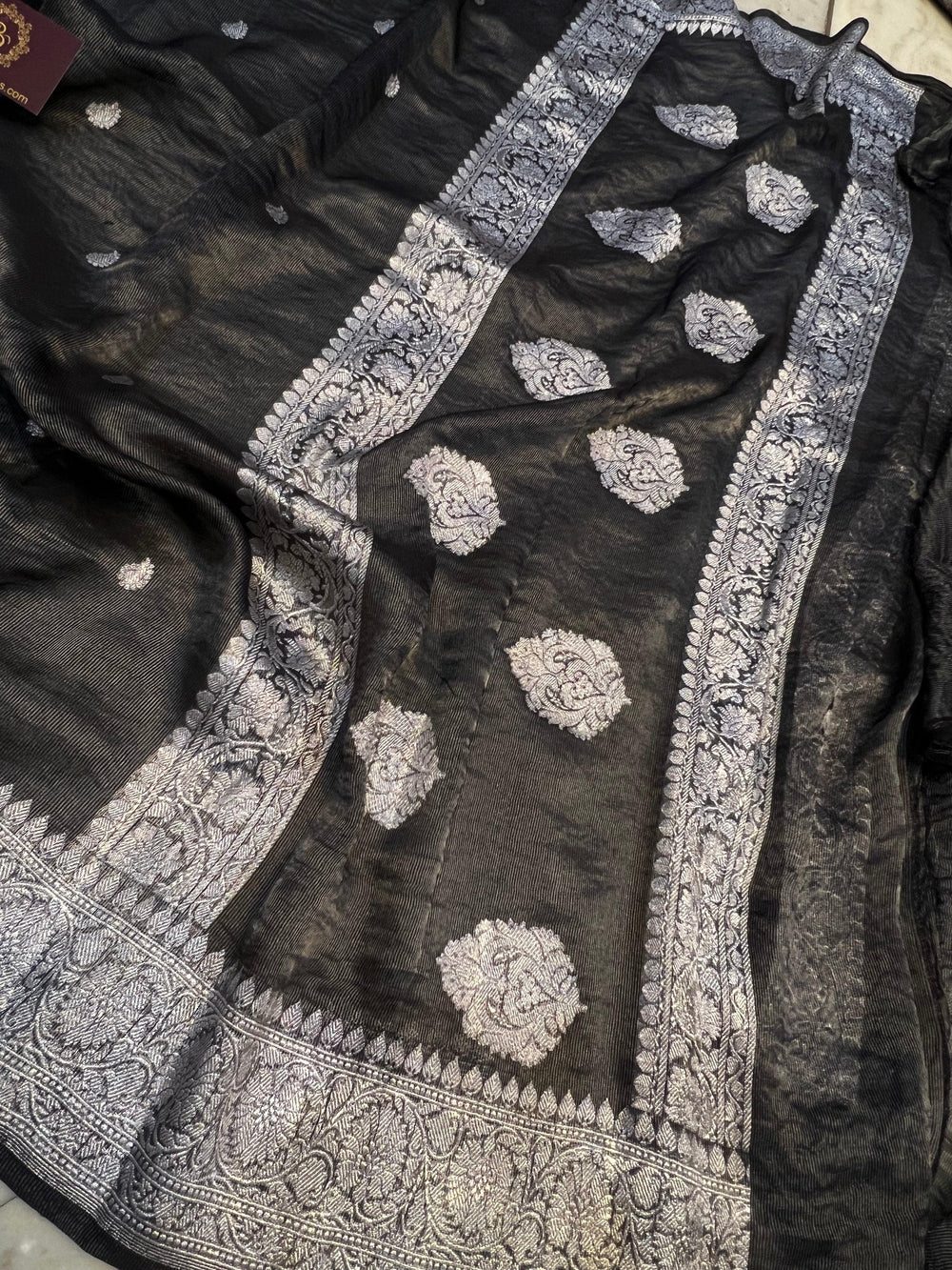 Silver zari Kadhwa border and handwoven butis on Banarasi tissue silk saree
