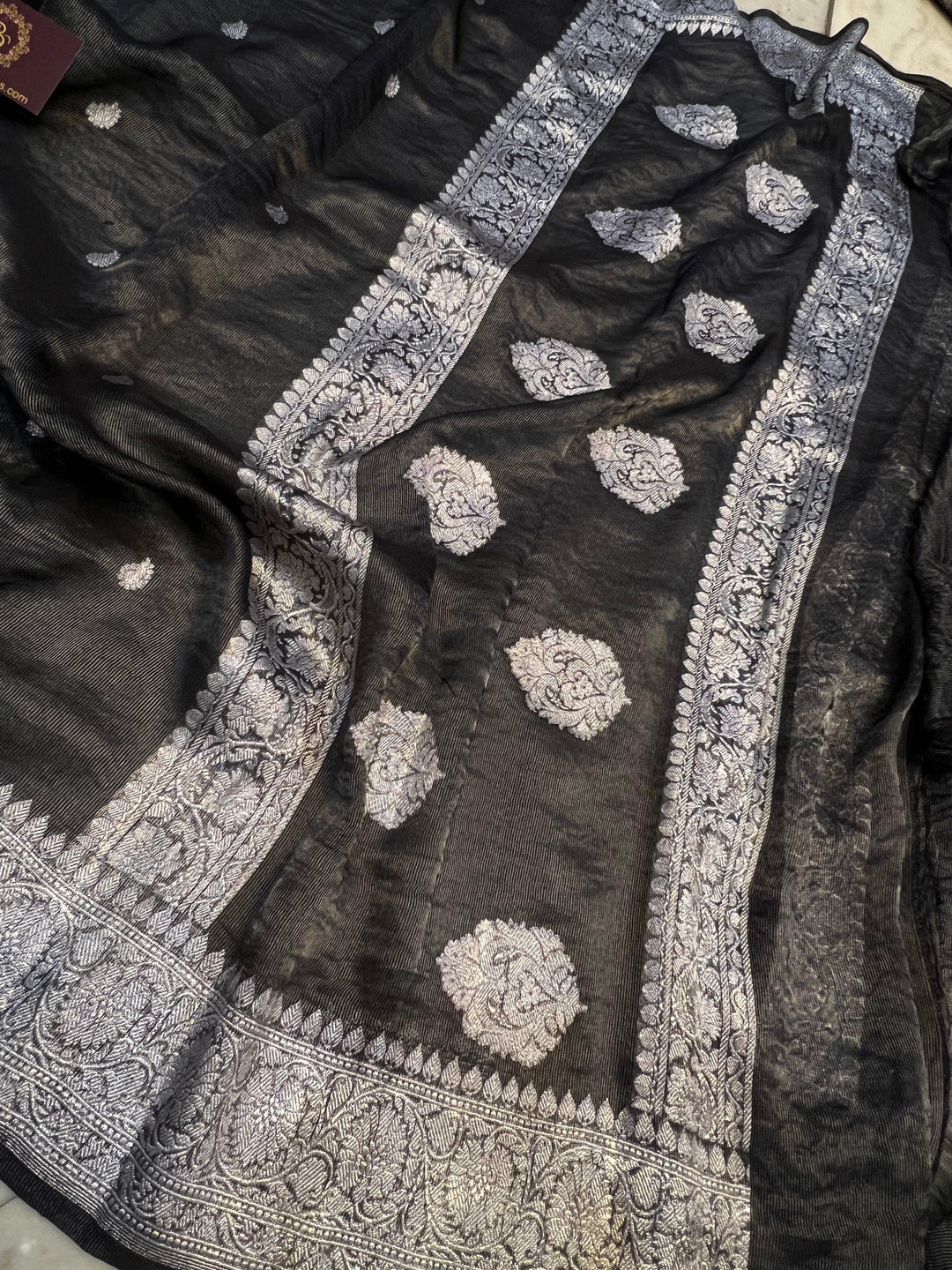 Silver zari Kadhwa border and handwoven butis on Banarasi tissue silk saree