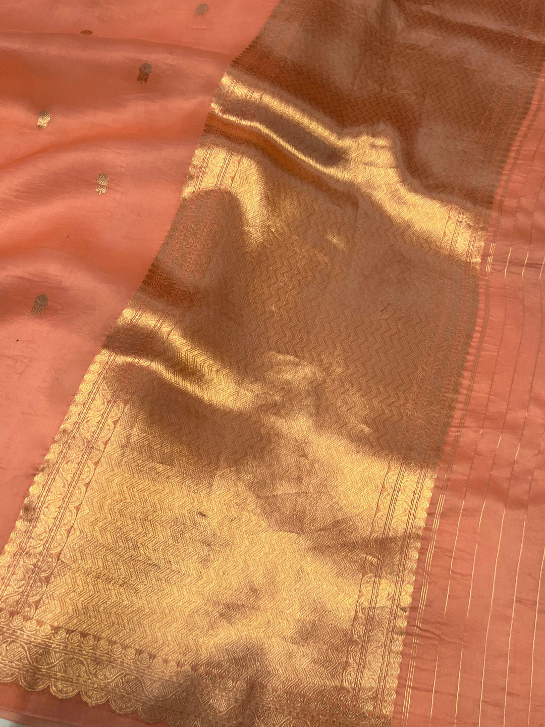 Elegant pallu of pure Kora silk Banarasi saree with subtle golden zari detailing