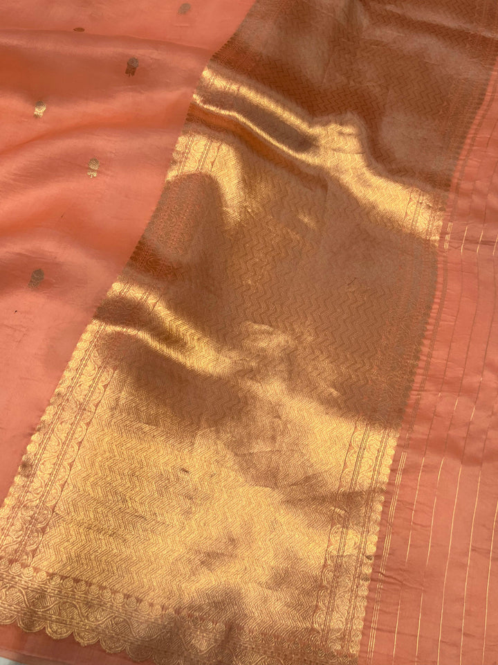 Elegant pallu of pure Kora silk Banarasi saree with subtle golden zari detailing