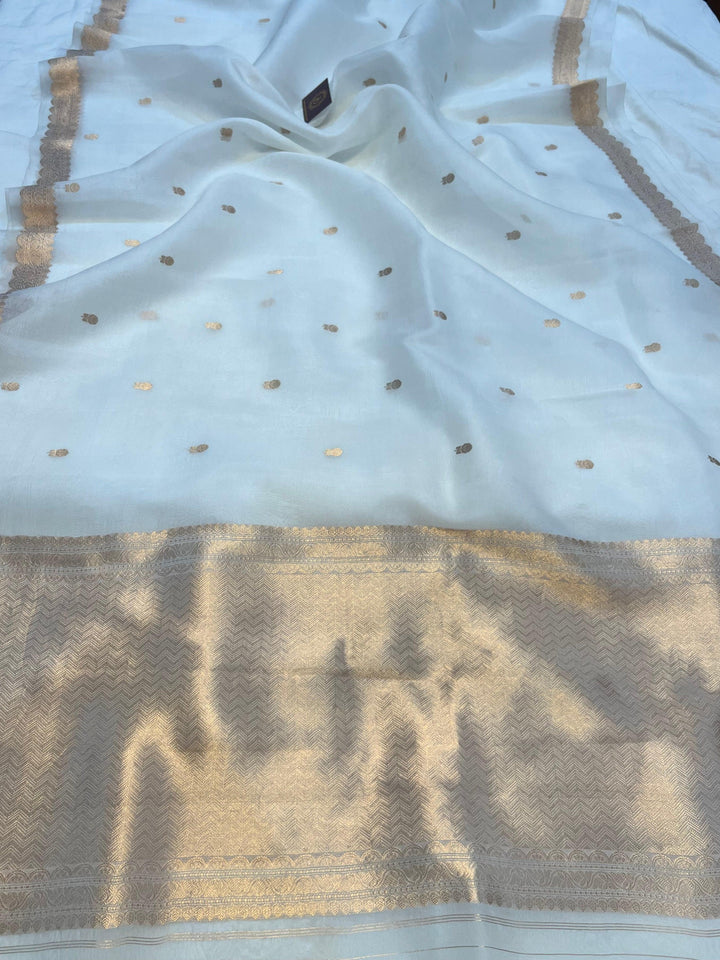 Pure Kora Silk Handloom Banarasi Saree draped with golden zari butis and sleek Banarasi border, woven using Kadhwa technique