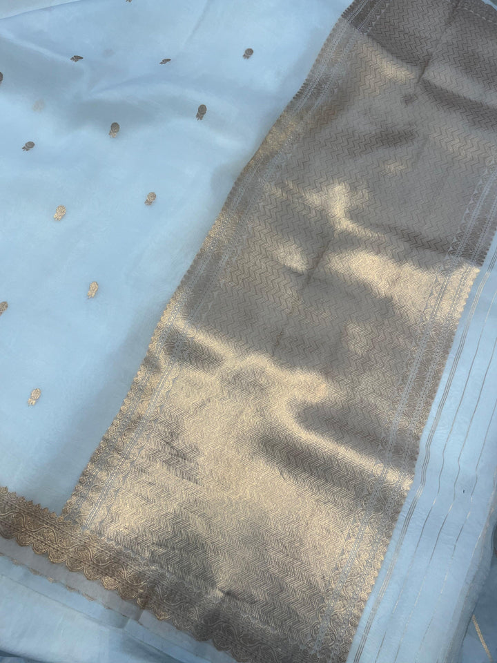 Elegant pallu of pure Kora silk Banarasi saree with subtle golden zari detailing