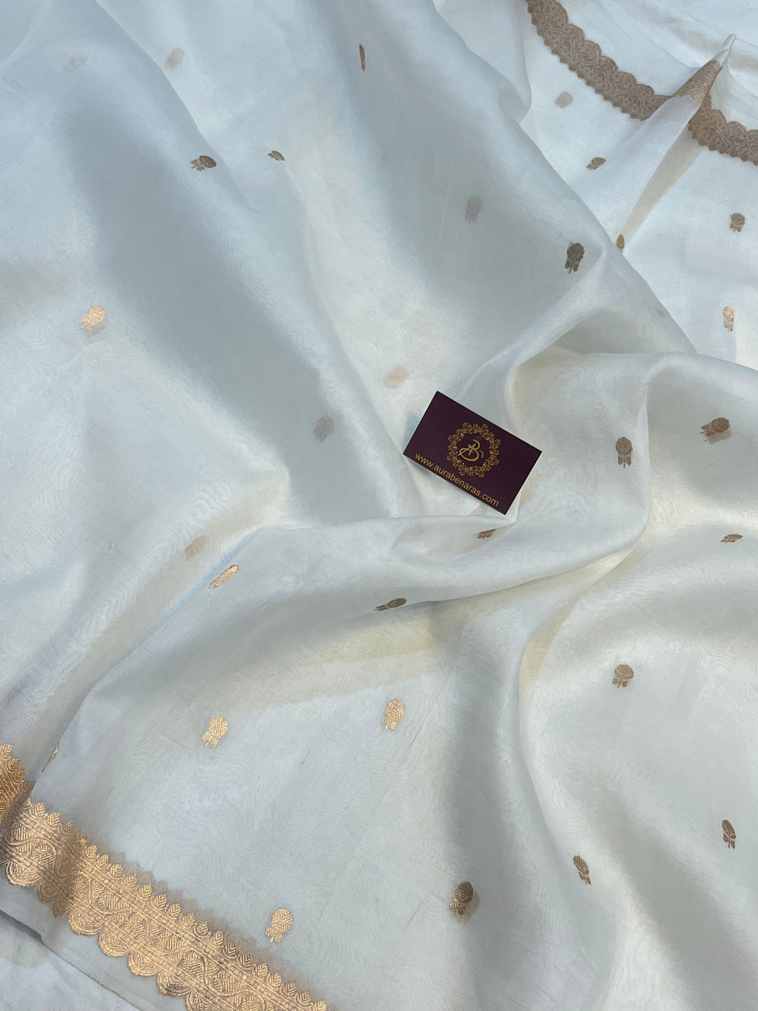 Sleek golden zari Banarasi border on lightweight organza silk saree, highlighting fine craftsmanship