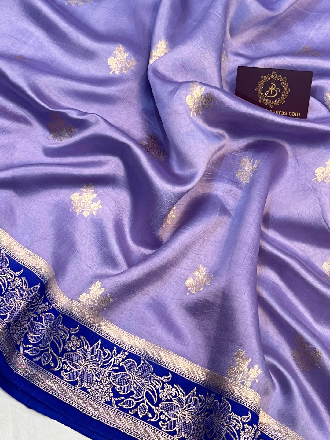 Handwoven Kadhwa floral motifs on luxurious Banarasi silk fabric
