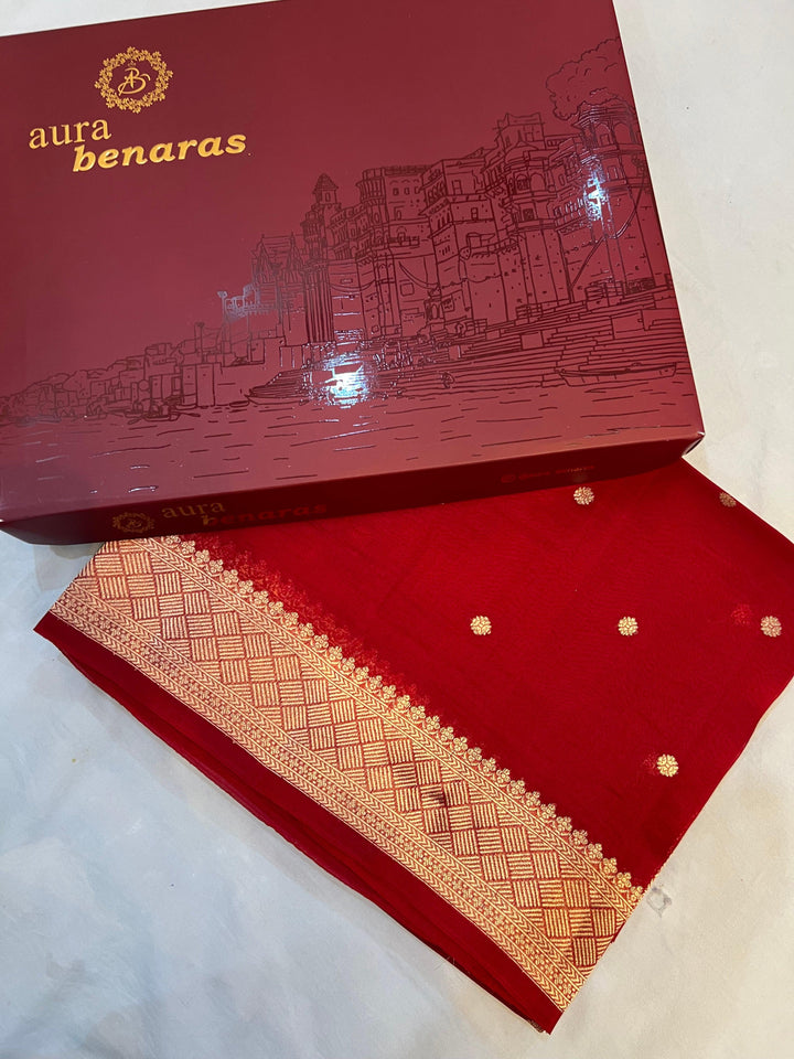 Neatly folded handloom Kora silk Banarasi saree highlighting zari butis, sleek border, and Konia motif