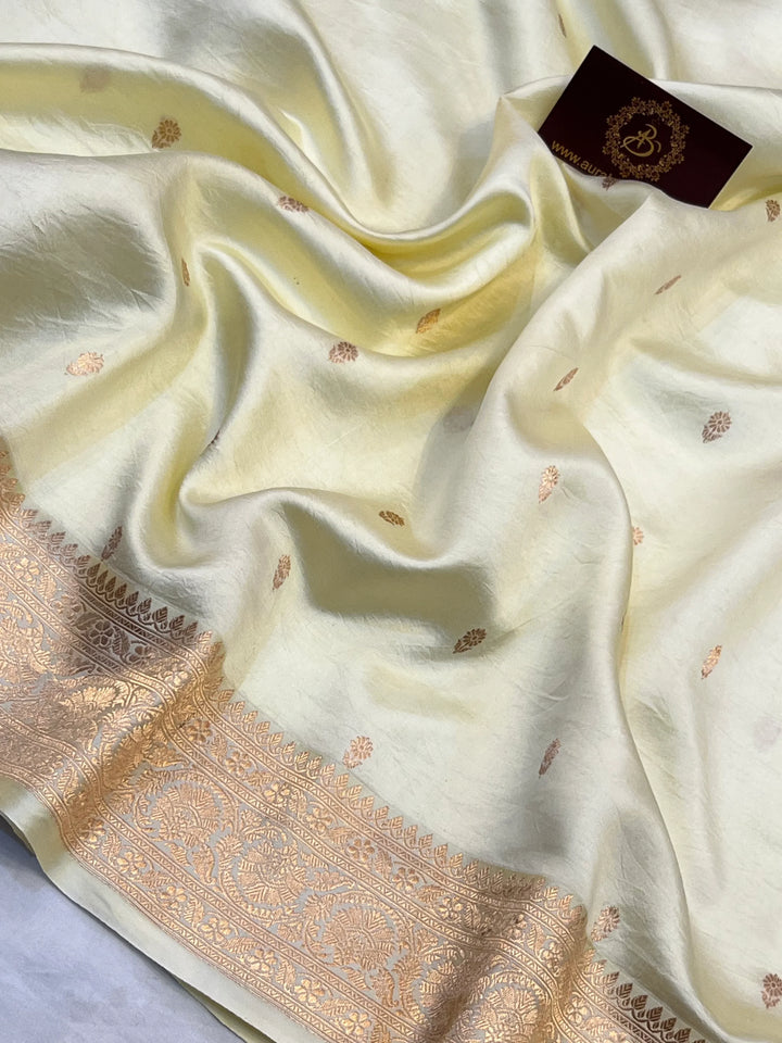 Pale Yellow Pure silk handloom Banarasi saree with Kadhwa butis, golden zari border, and striped blouse piece in rich traditional design