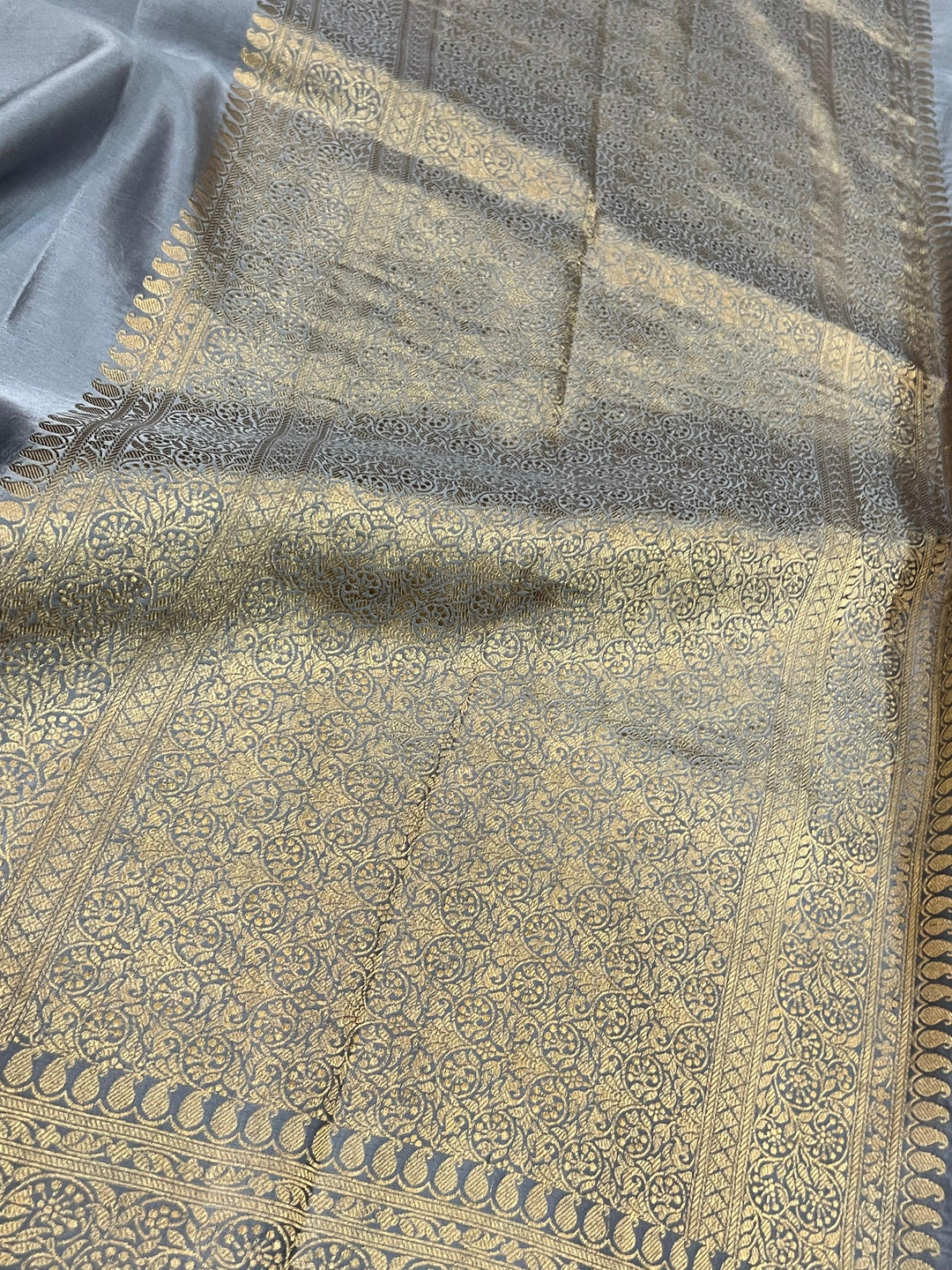 Handwoven pure Banarasi Mashru silk saree with Kadhwa motifs and golden zari border