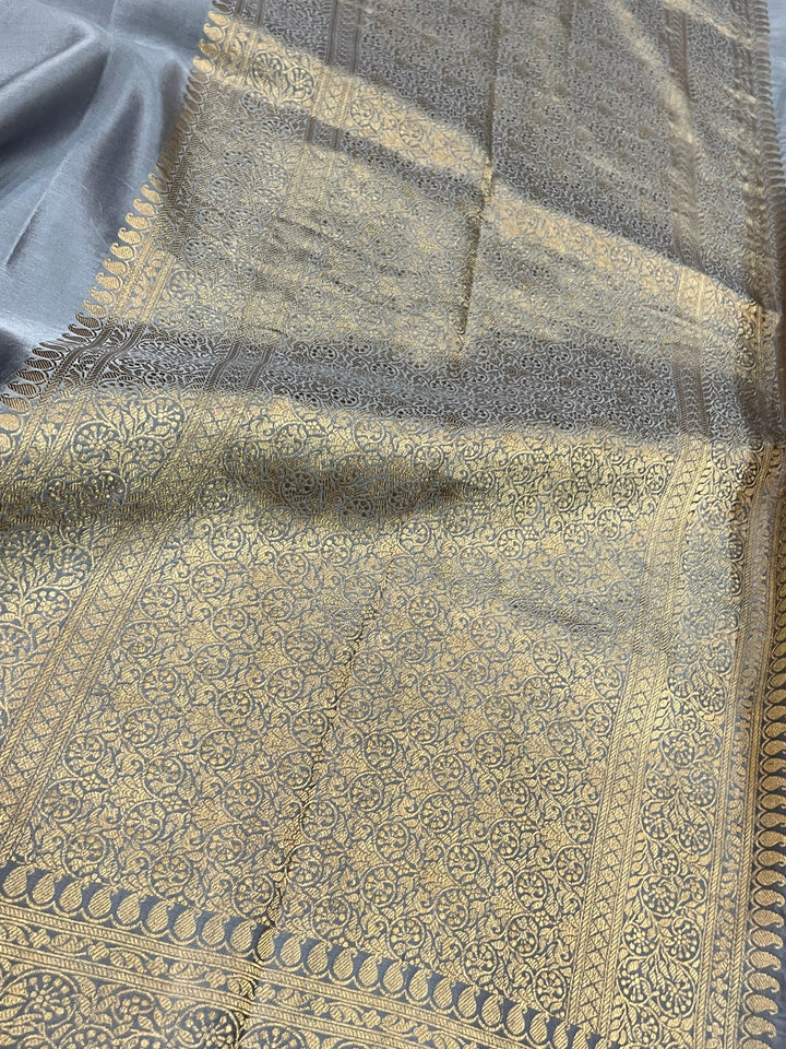 Handwoven pure Banarasi Mashru silk saree with Kadhwa motifs and golden zari border