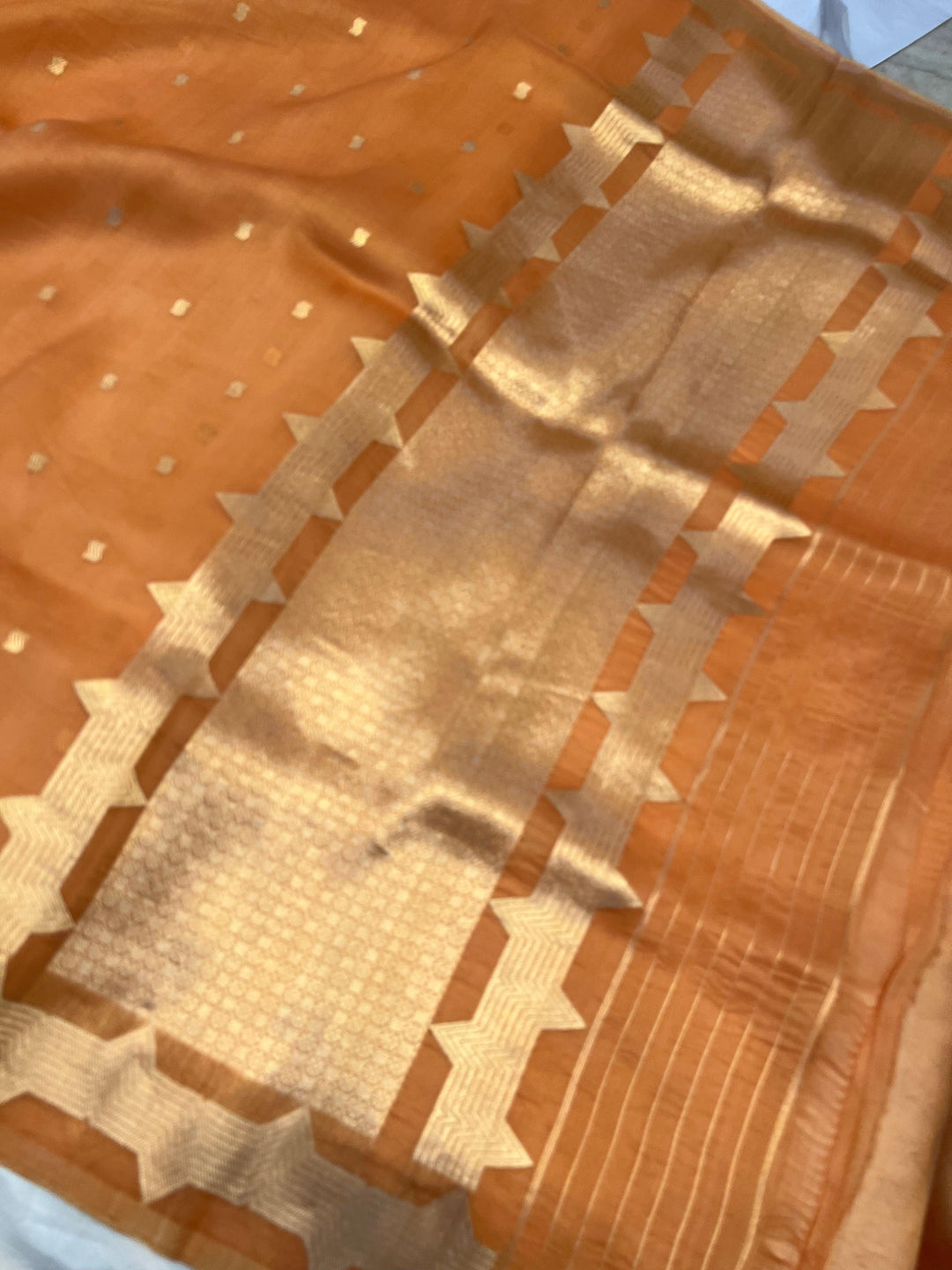 Elegant pallu of pure Kora silk Banarasi saree with subtle golden zari detailing