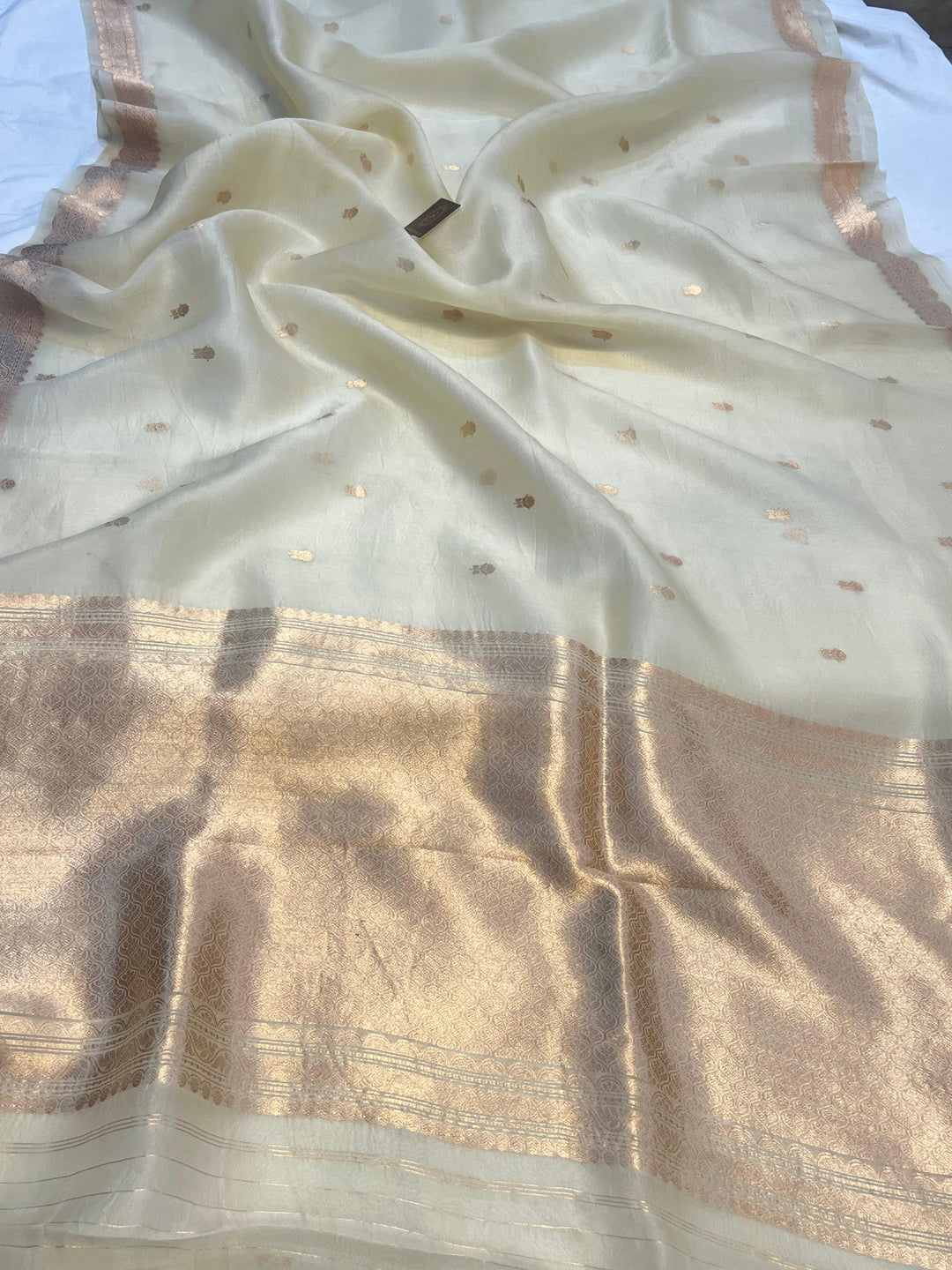Pure Kora Silk Handloom Banarasi Saree draped with golden zari butis and sleek Banarasi border, woven using Kadhwa technique