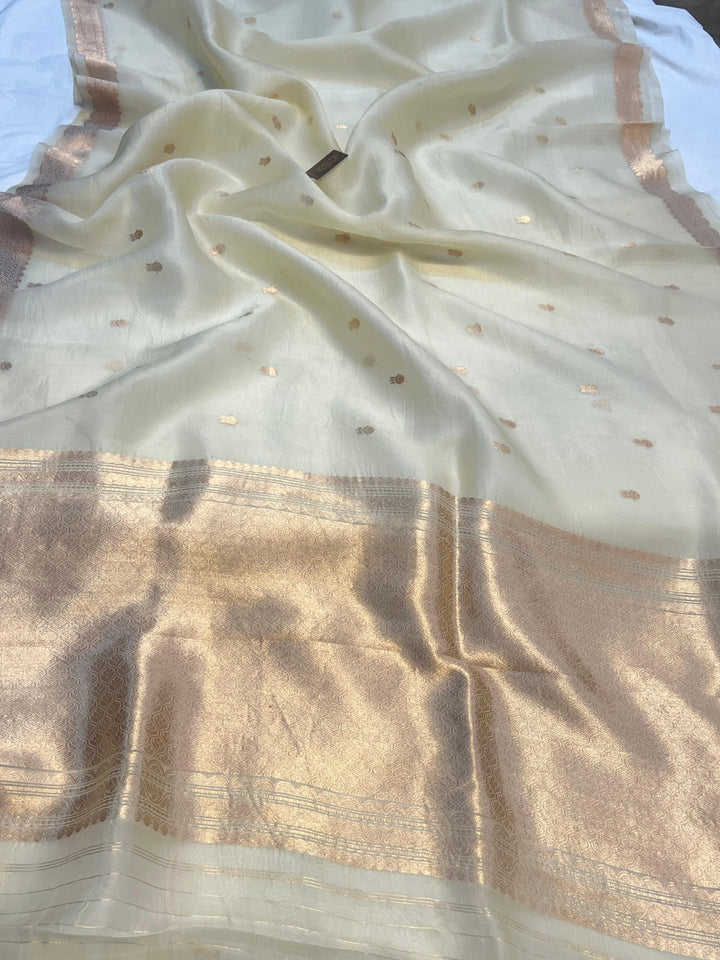 Pure Kora Silk Handloom Banarasi Saree draped with golden zari butis and sleek Banarasi border, woven using Kadhwa technique