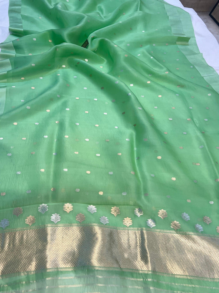 Pure Kora Silk Handloom Banarasi Saree draped with Sona Rupa butis and contrasting Mashru silk border