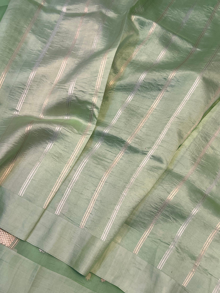 Striped silk blouse piece included with the Kora silk Banarasi saree for coordinated styling