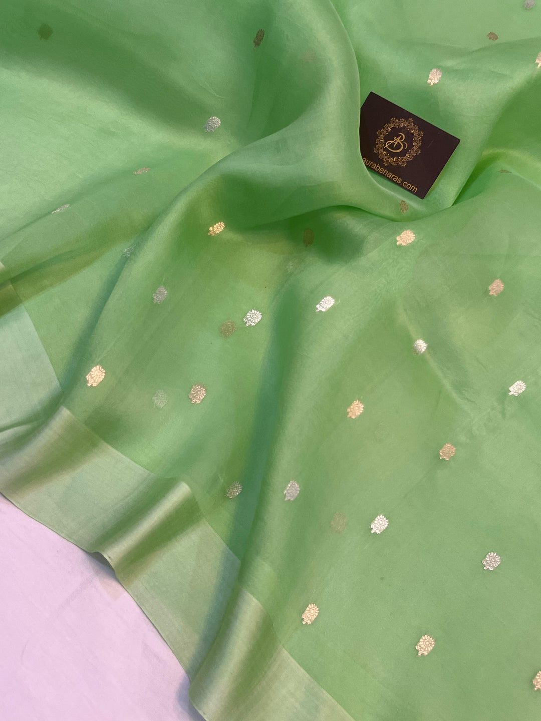 Gold and silver Sona Rupa butis woven on translucent Kora silk using Kadhwa technique