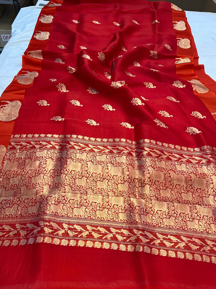 Reddish Orange Kora Silk Banarasi Saree | Cow Motif Border
