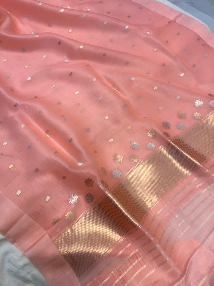 Elegant pallu of the Banarasi saree featuring delicate Sona Rupa zari work and smooth Mashru silk edge