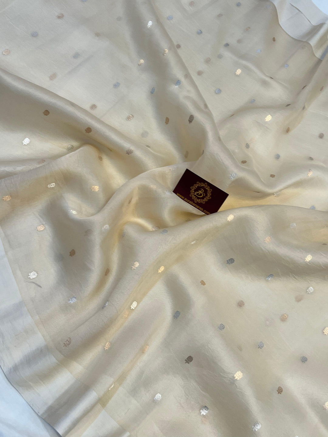 Rich Mashru silk Banarasi border with golden zari detailing on handloom Kora silk saree