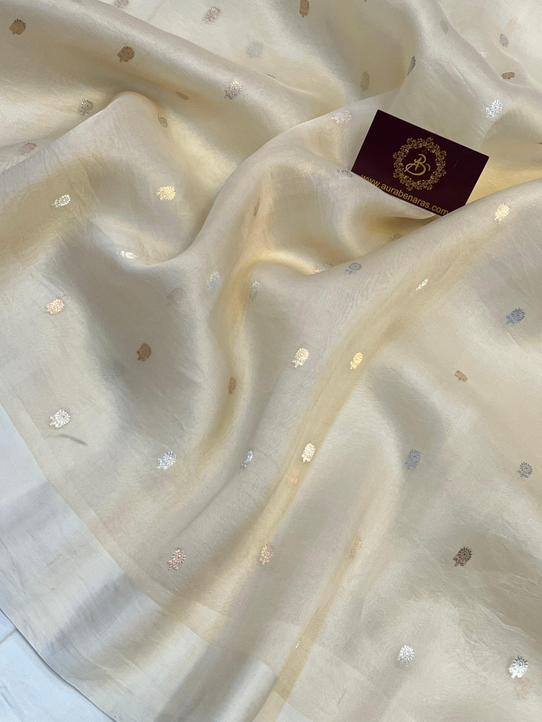 Gold and silver Sona Rupa butis woven on translucent Kora silk using Kadhwa technique