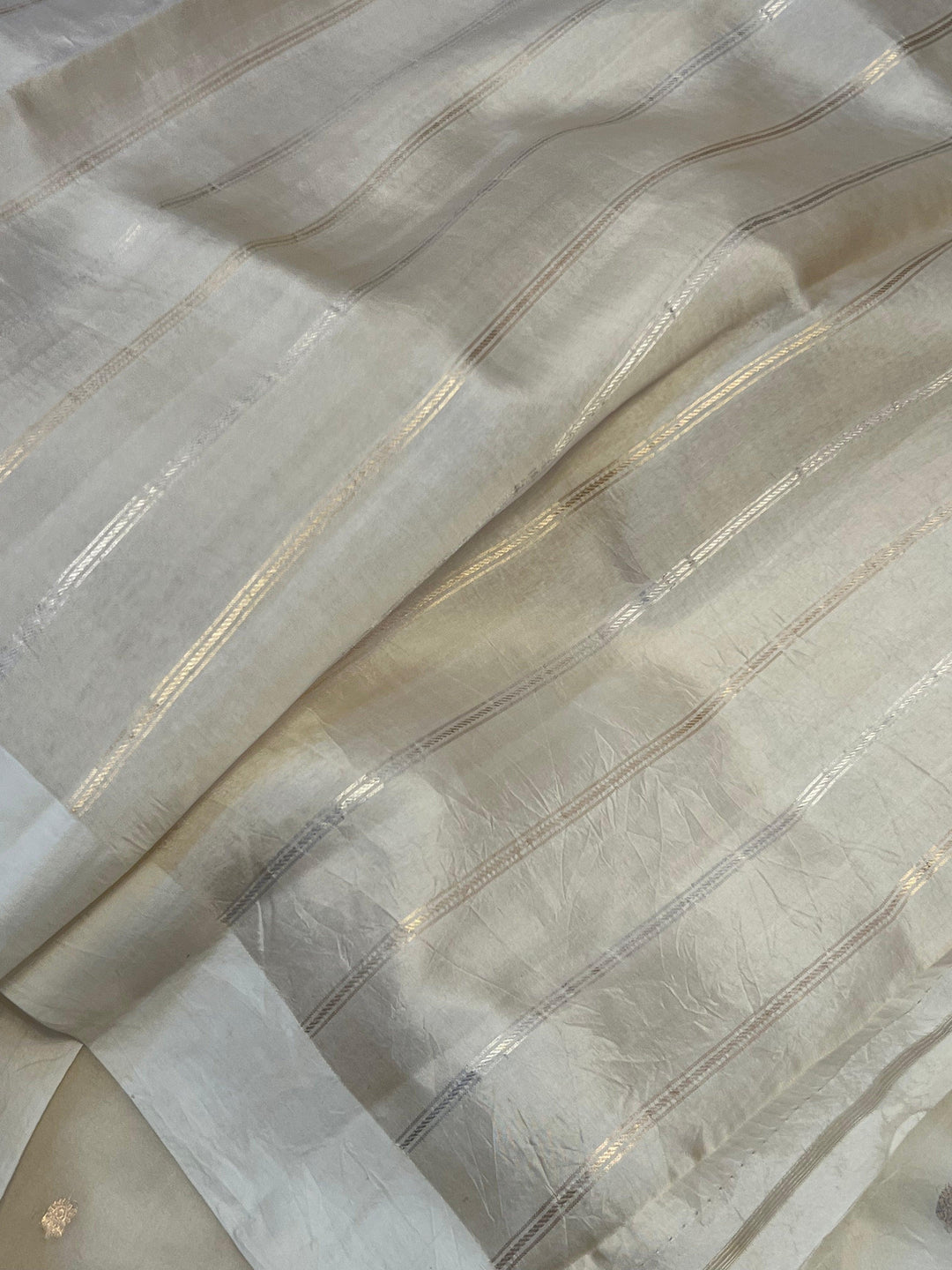 Striped silk blouse piece included with the Kora silk Banarasi saree for coordinated styling