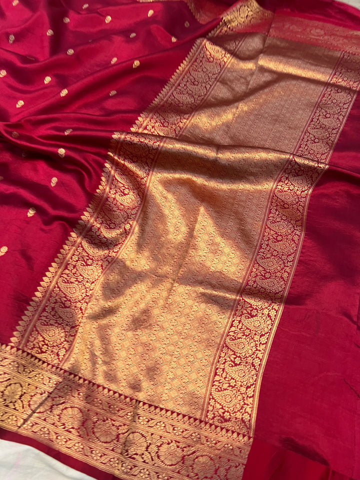 Maroon pure silk handloom Banarasi saree with Kadhwa butis, golden zari border, and striped blouse piece in rich traditional design