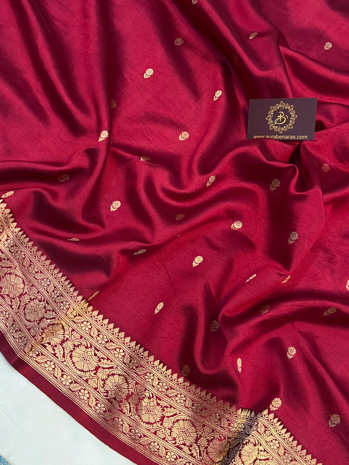 Maroon pure silk handloom Banarasi saree with Kadhwa butis, golden zari border, and striped blouse piece in rich traditional design