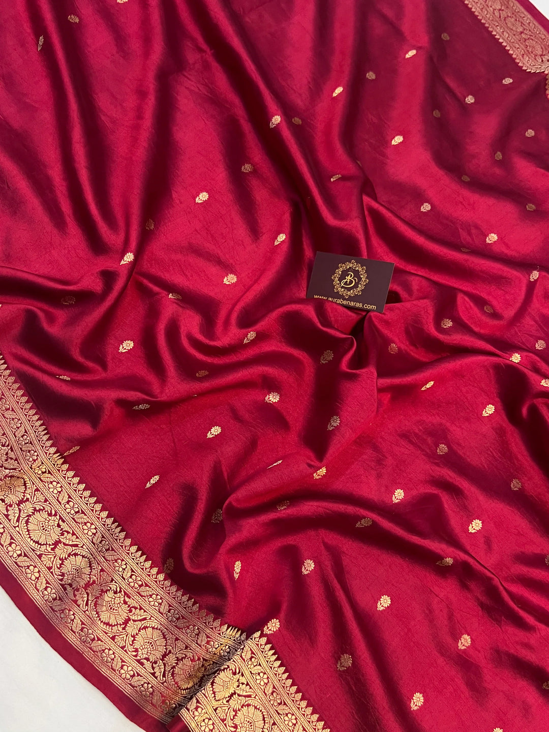 Maroon pure silk handloom Banarasi saree with Kadhwa butis, golden zari border, and striped blouse piece in rich traditional design
