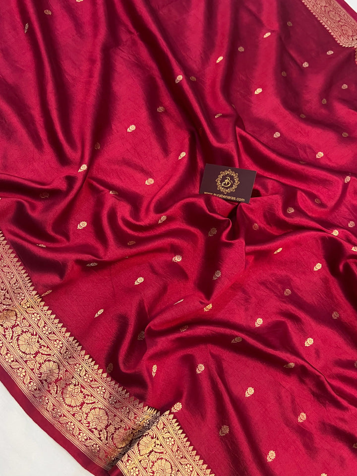 Maroon pure silk handloom Banarasi saree with Kadhwa butis, golden zari border, and striped blouse piece in rich traditional design
