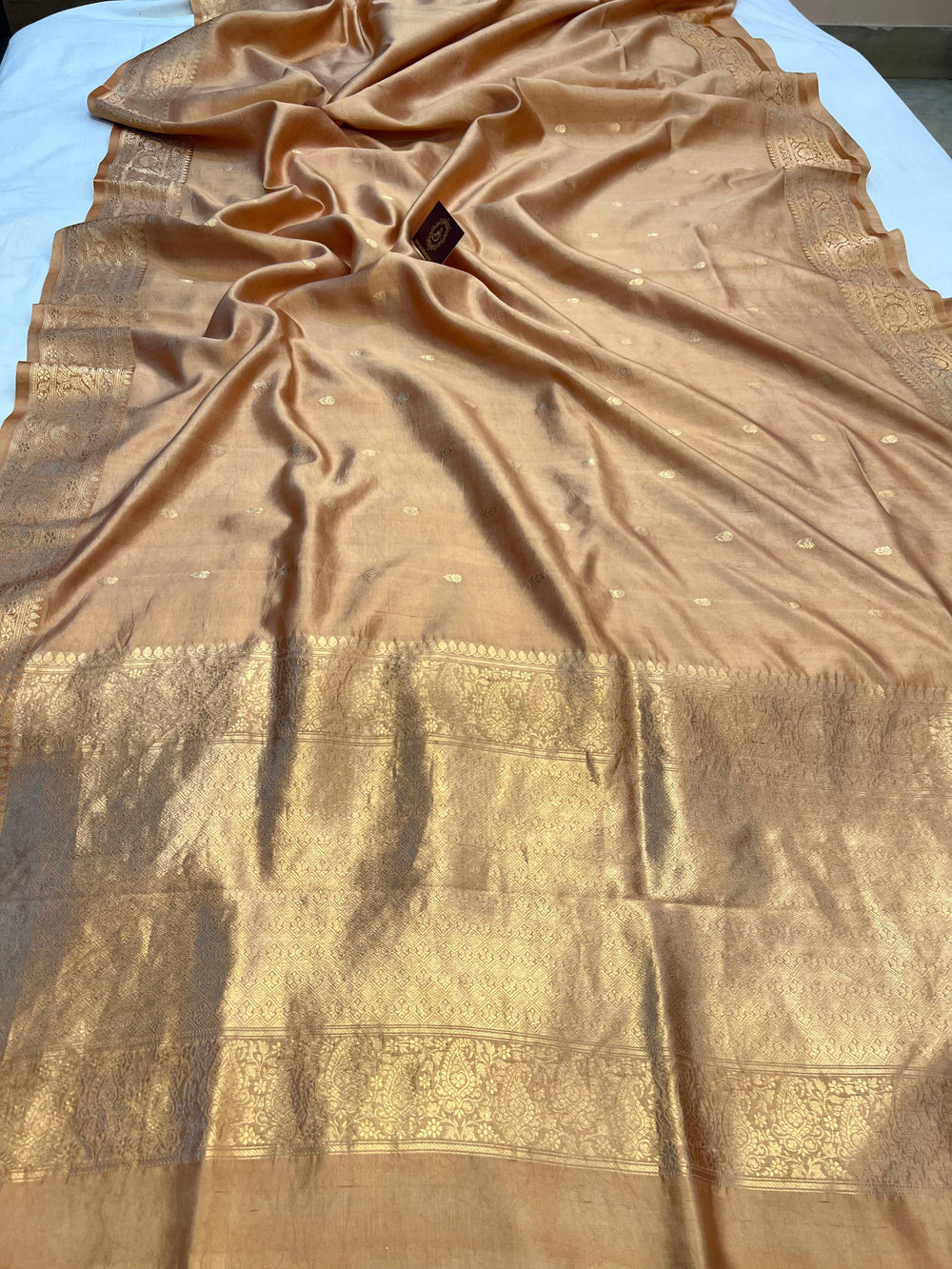Golden Pure silk handloom Banarasi saree with Kadhwa butis, golden zari border, and striped blouse piece in rich traditional design
