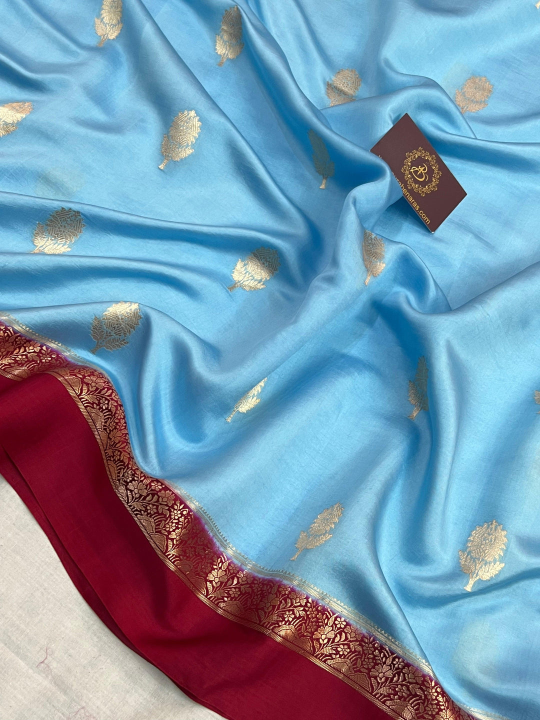 Intricate golden zari Kadhwa butas on pure silk Banarasi saree