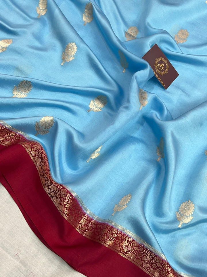 Intricate golden zari Kadhwa butas on pure silk Banarasi saree
