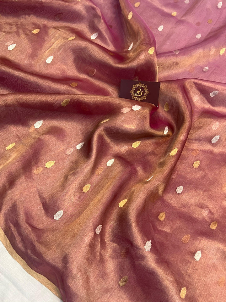 Intricate gold and silver Kadhwa butis on shaded tissue silk Banarasi saree