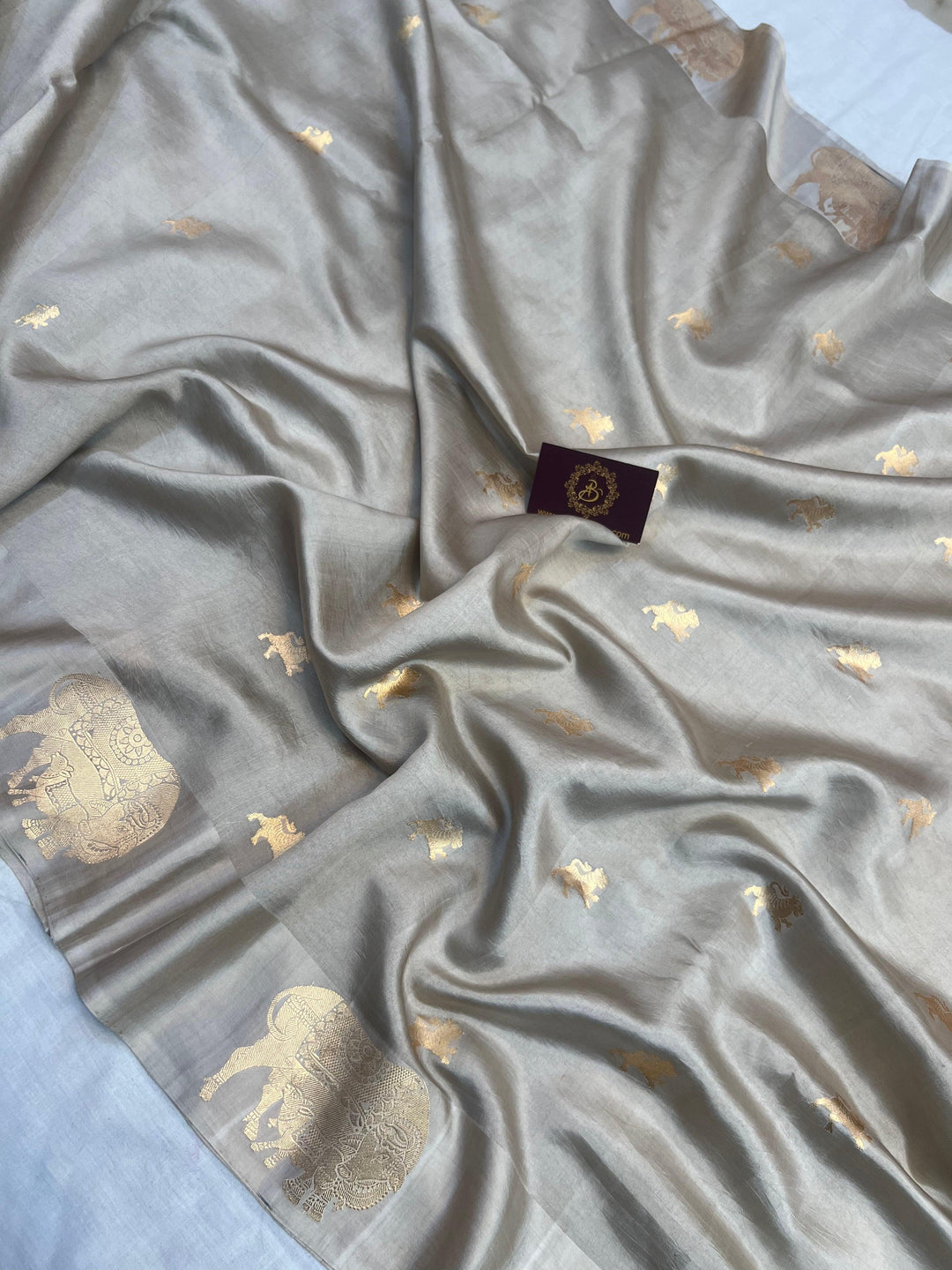 Detailed view of golden zari Kadhwa motifs on pure silk Banarasi saree