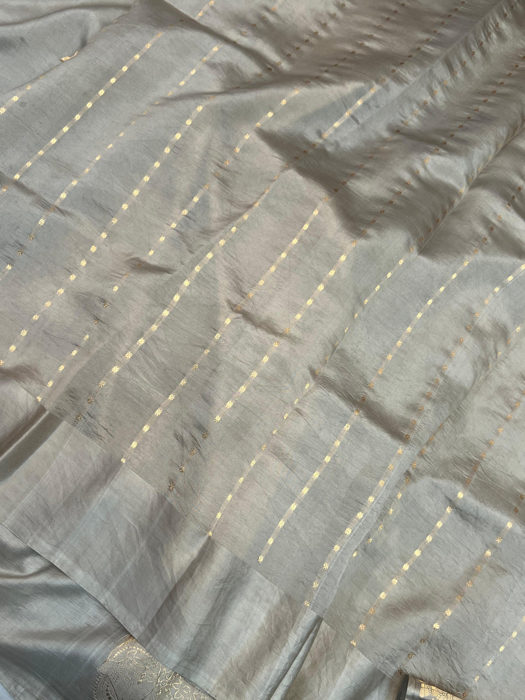 Plain blouse piece with small butis included with pure silk Banarasi saree