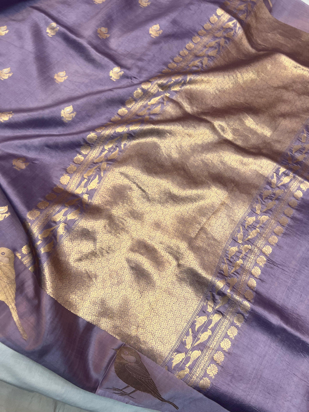 Pure silk handloom Banarasi saree with golden zari Kadhwa motifs and Mashru silk border featuring animal designs