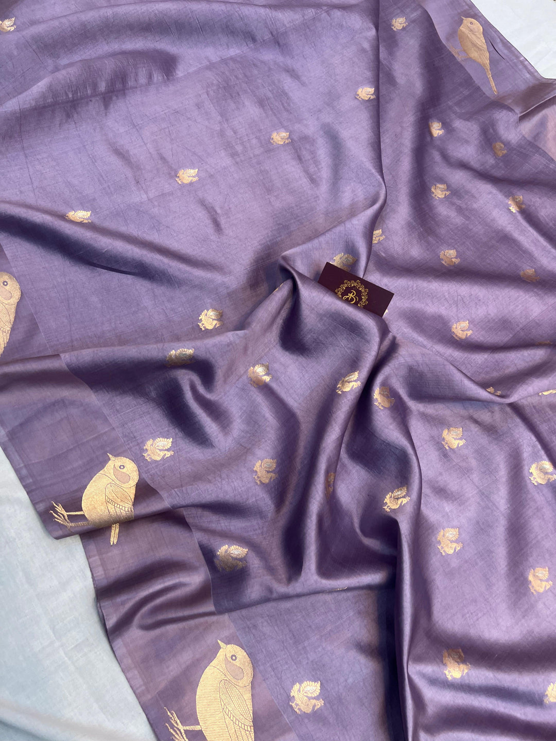 Close-up of Mashru silk border with intricate Kadhwa animal motifs on Banarasi saree