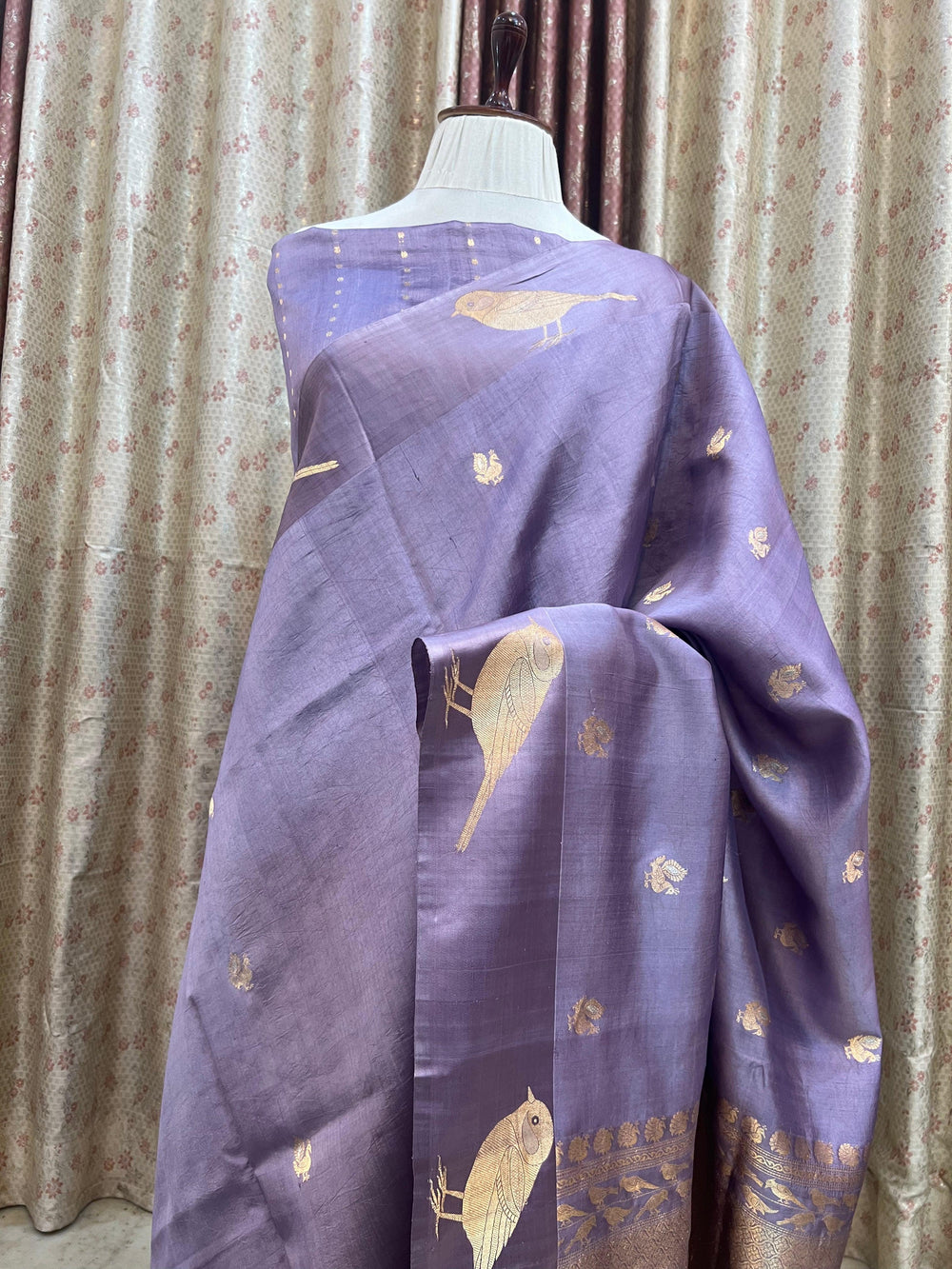 Pure silk handloom Banarasi saree with golden zari Kadhwa motifs and Mashru silk border featuring animal designs