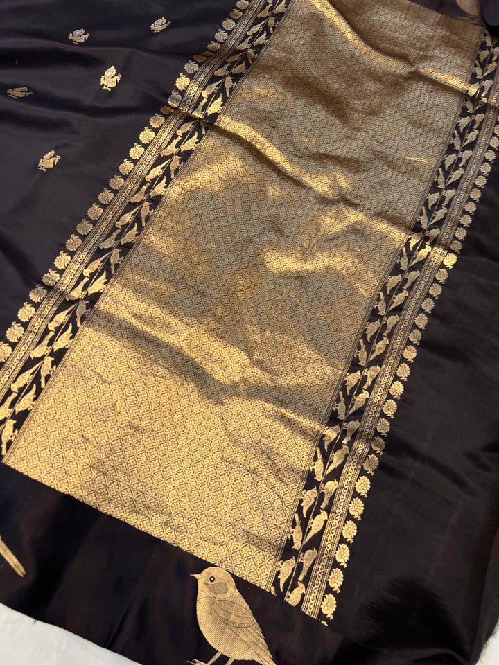 Close-up of Mashru silk border with intricate Kadhwa animal motifs on Banarasi saree