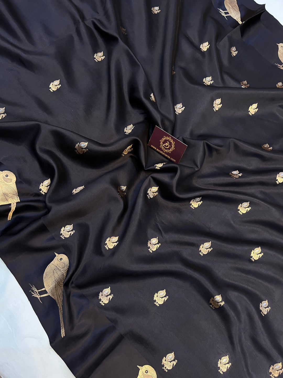 Close-up of Mashru silk border with intricate Kadhwa animal motifs on Banarasi saree