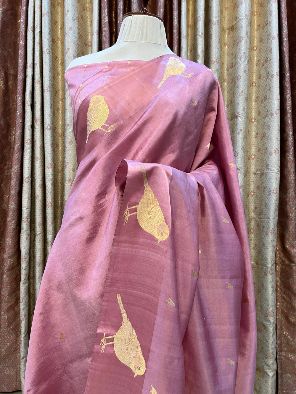 Pure silk handloom Banarasi saree with golden zari Kadhwa motifs and Mashru silk border featuring animal designs