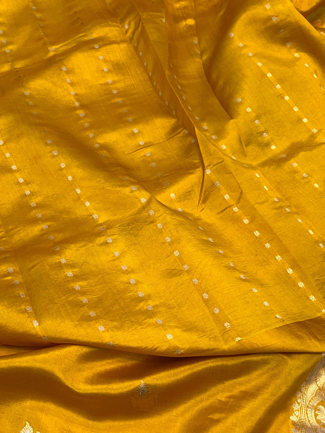 Plain blouse piece with small butis included with pure silk Banarasi saree
