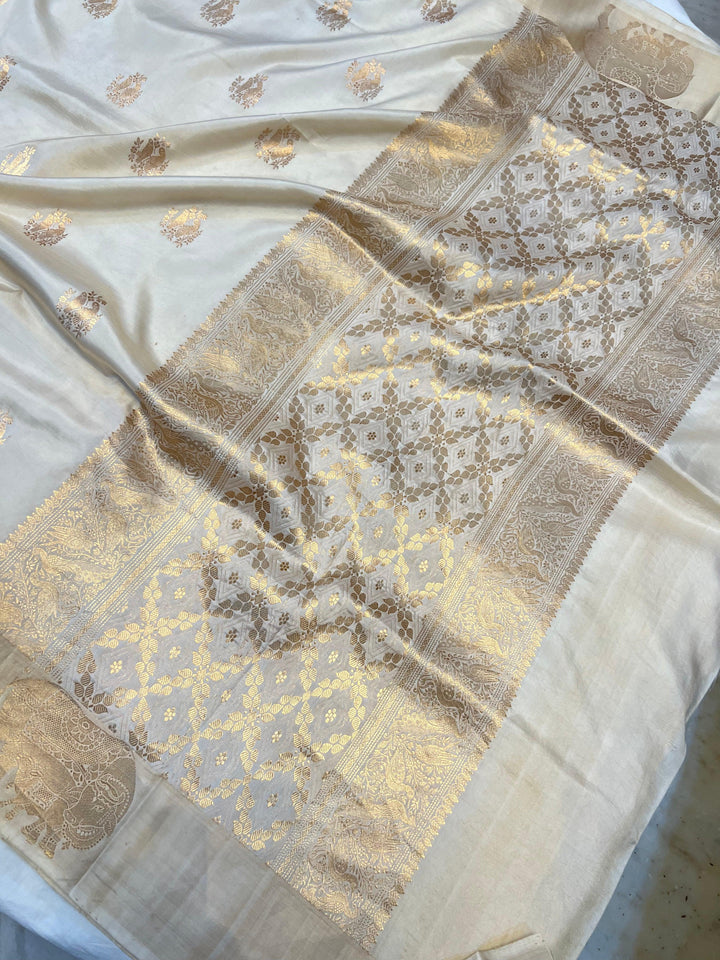 Close-up of Mashru silk border with intricate Kadhwa animal motifs on Banarasi saree