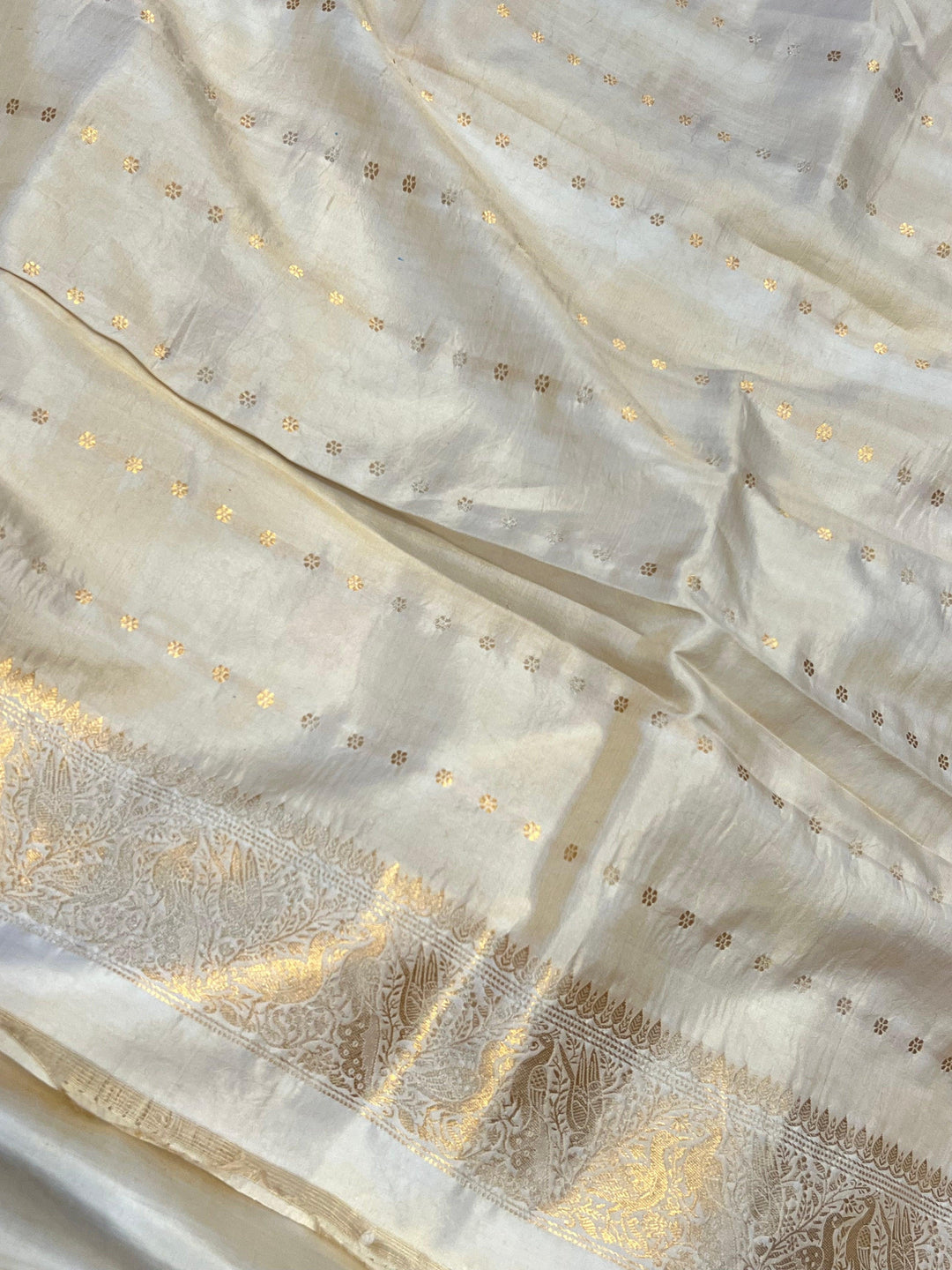 Plain blouse piece with small butis included with pure silk Banarasi saree