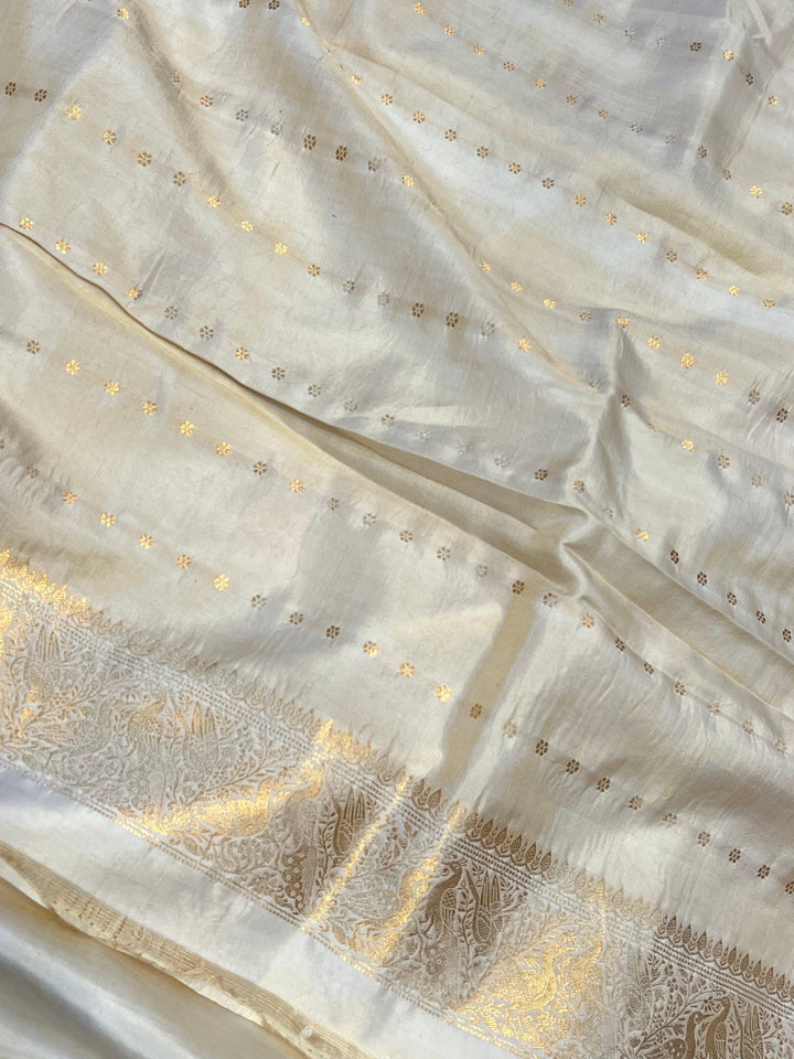 Plain blouse piece with small butis included with pure silk Banarasi saree