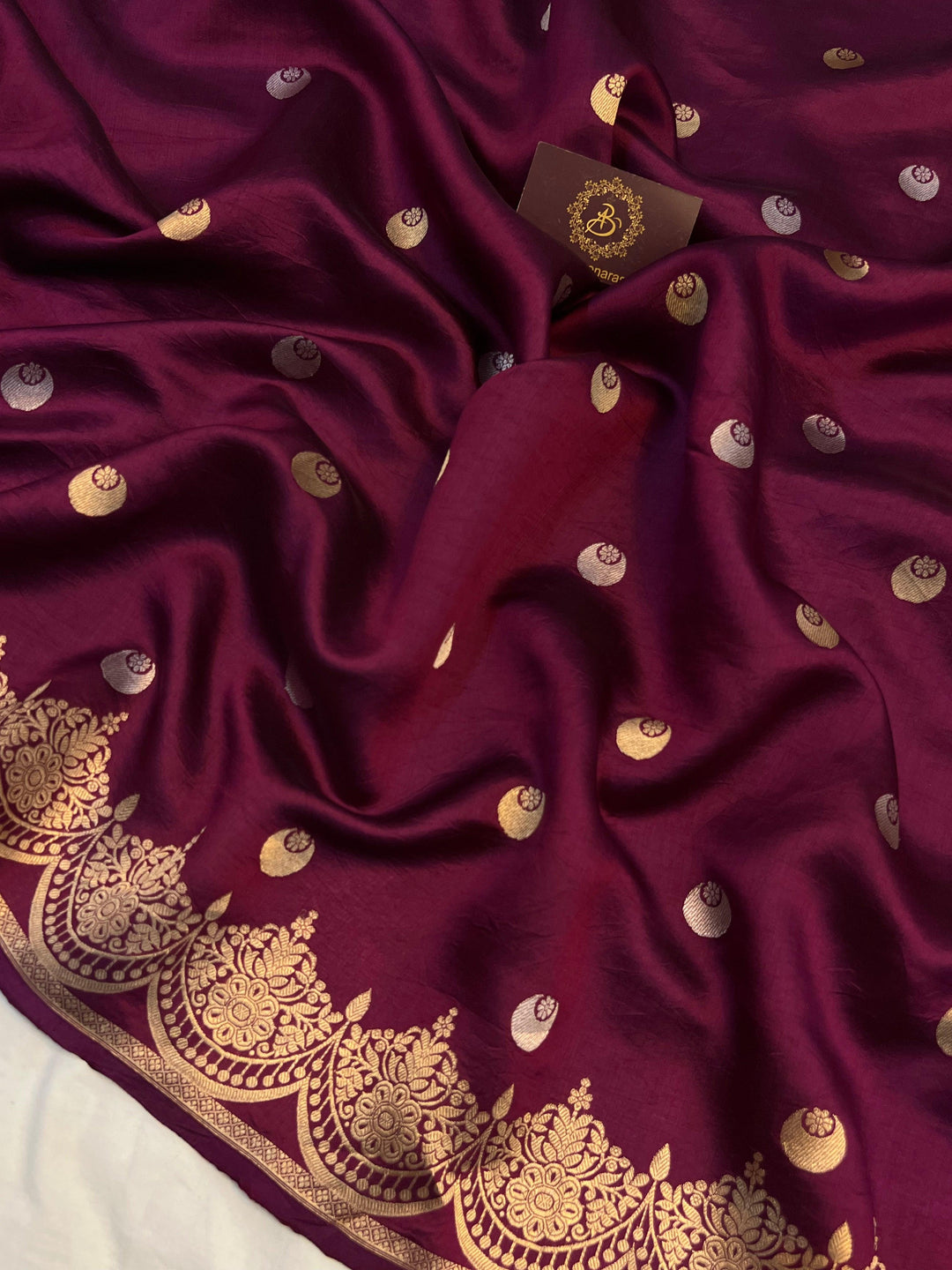 Detailed view of golden zari Kadhwa chand butis on pure silk Banarasi saree.