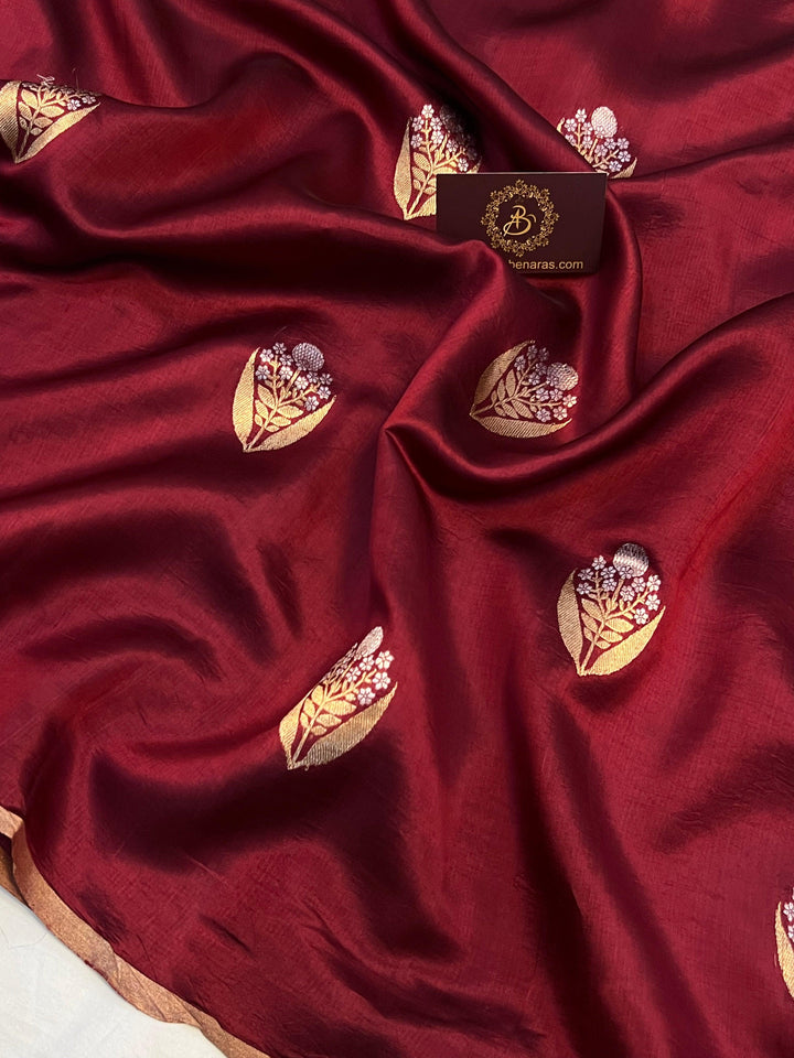 Detailed view of gold and silver Kadhwa Sona Rupa motifs on pure silk Banarasi saree.