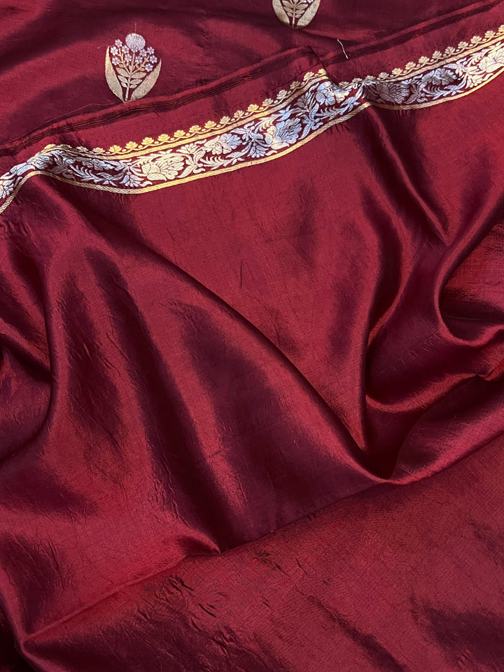 Plain blouse piece with matching border included with pure silk Banarasi saree.