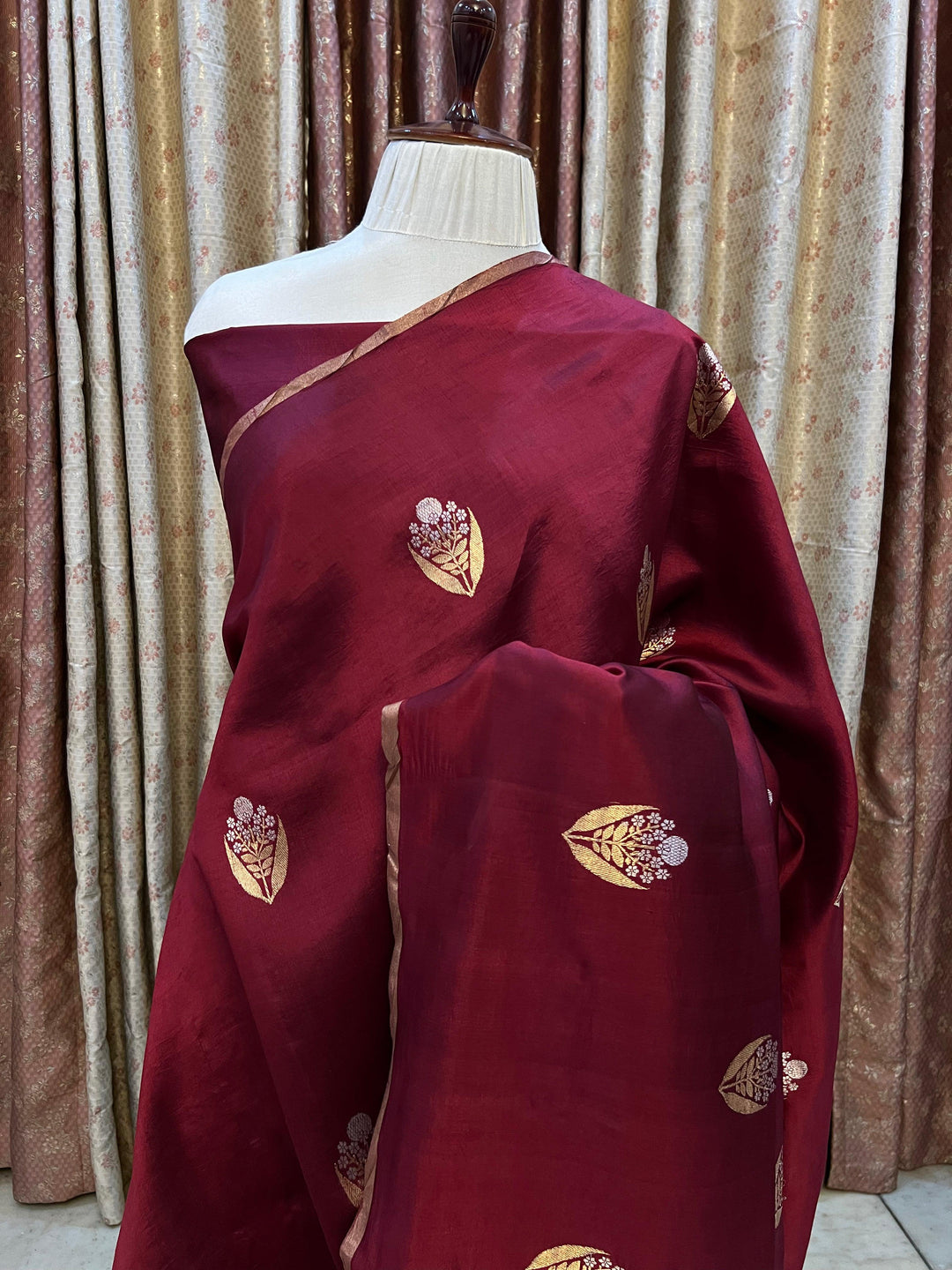 Detailed view of gold and silver Kadhwa Sona Rupa motifs on pure silk Banarasi saree.