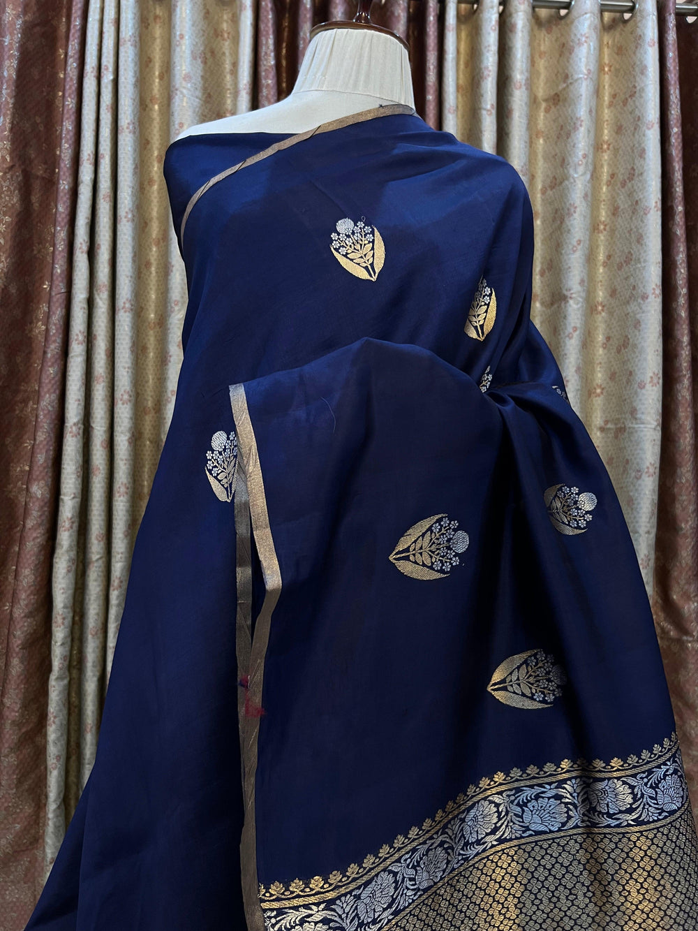 Detailed view of gold and silver Kadhwa Sona Rupa motifs on pure silk Banarasi saree.