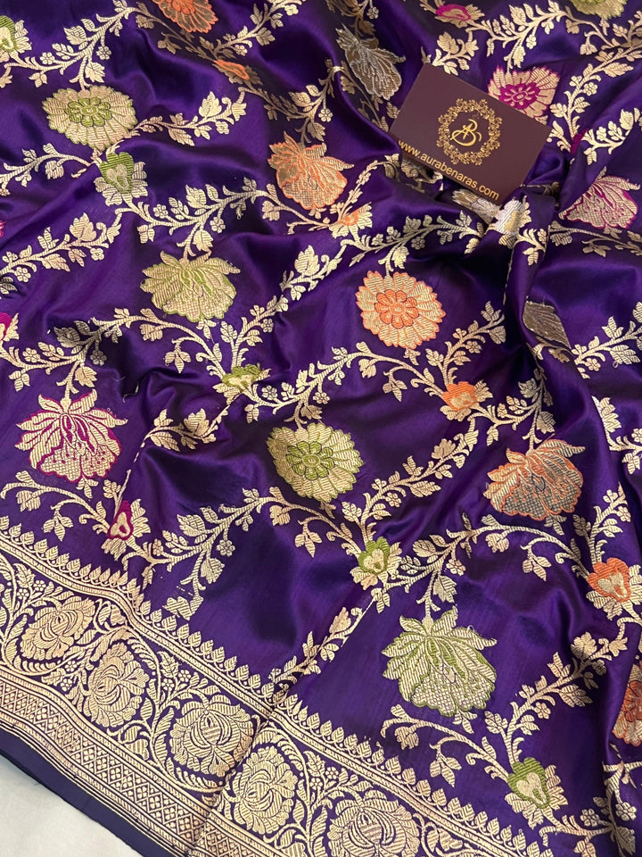 Close-up of detailed Kadhwa jaal weaving with floral motifs and vibrant Meenakari-inspired accents on pure Katan silk Banarasi saree